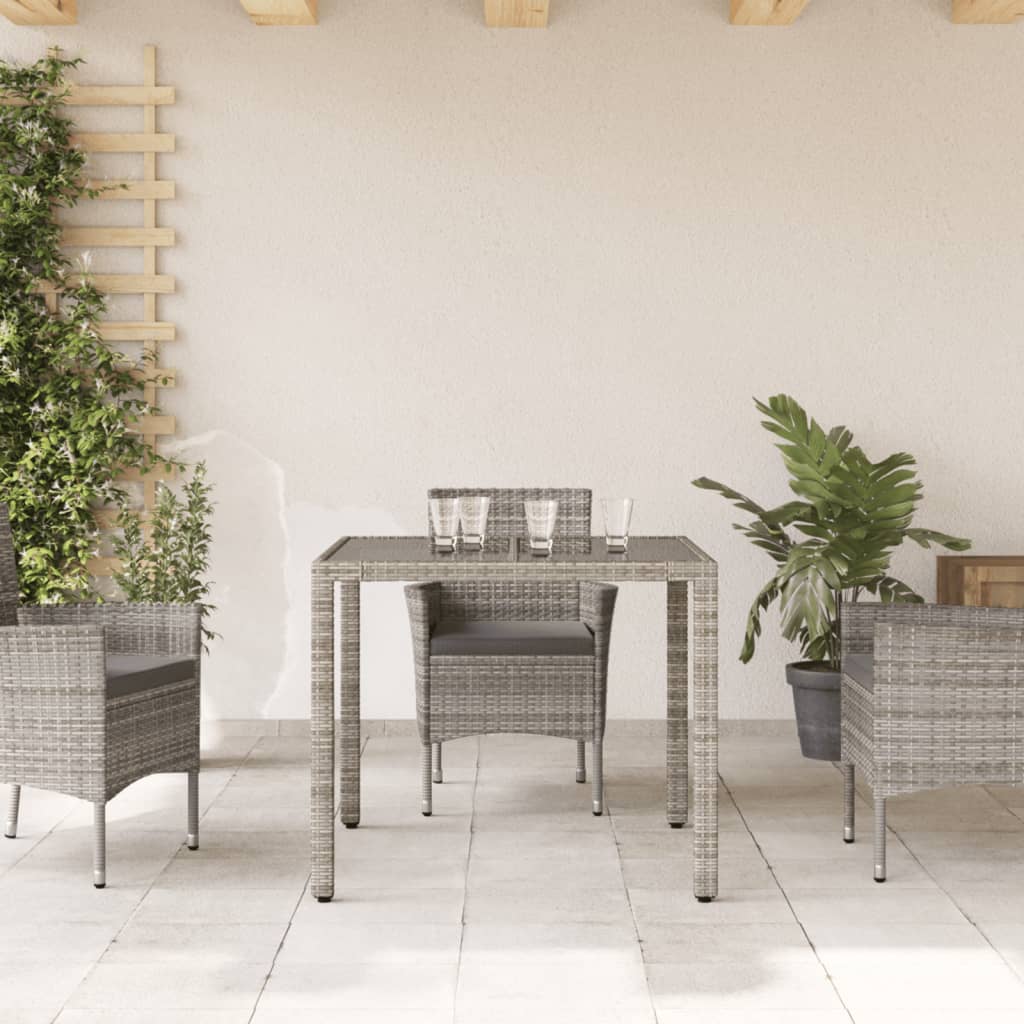 vidaXL Mesa de jardín superficie de vidrio ratán PE gris 90x90x75 cm